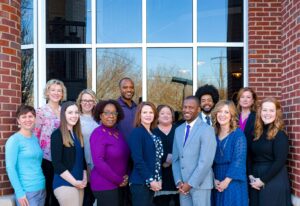 Staff at the Community Foundation of Greater Chattanooga, from left to right: Keely Gilliland, Marisa Ogles, Catherine Coker, Robin Posey, Dr. Stephanie Young, Chris Adams, Maeghan Jones, Ashley Bice, Dwayne Marshall, Woodson Carpenter, Rebecca Underwood, Caroline Von Kessler, Rebekah Gouger. Photo by Matt Reiter.
