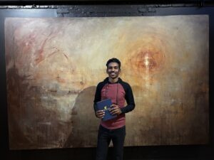 Ahmed with diploma
